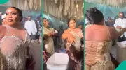 Nigerian Bride's Lightning Reflexes Foil Wedding Guest Attempting to Steal Sprayed Money | Legit.ng