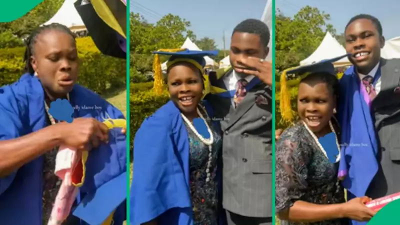Nigerian Graduate's Touching Gesture: Dresses Mum in His Gown, Video Goes Viral