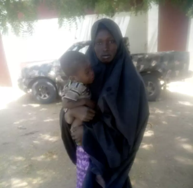 Wife of Neutralized Boko Haram Commander Surrenders with Child in Borno