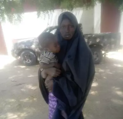 Wife of Neutralized Boko Haram Commander Surrenders with Child in Borno