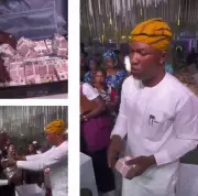 Nigerian Man Stuns Wedding Guests by Spraying Couple with Bundles of N5 Bills