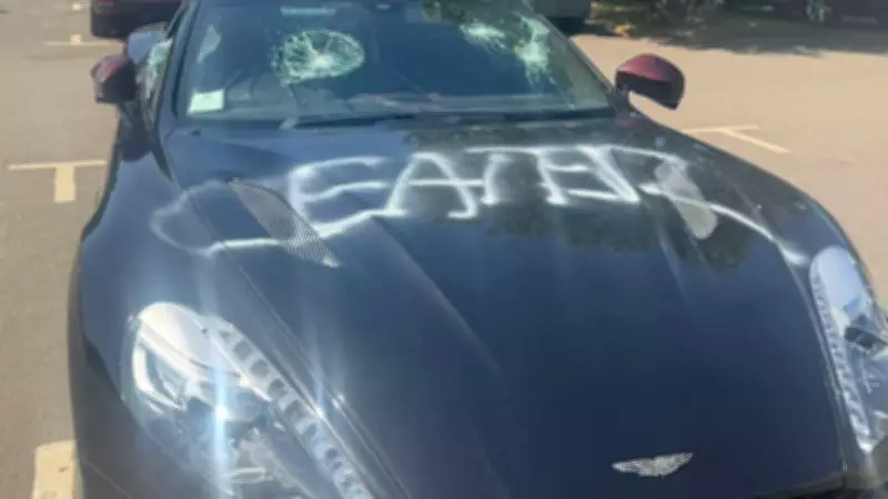 Masked vandal destroys £250k Aston Martin, sprays 'CHEATER' on bonnet