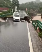 Bridge Collapse in China: Car Plunges Into River, Occupants Safe