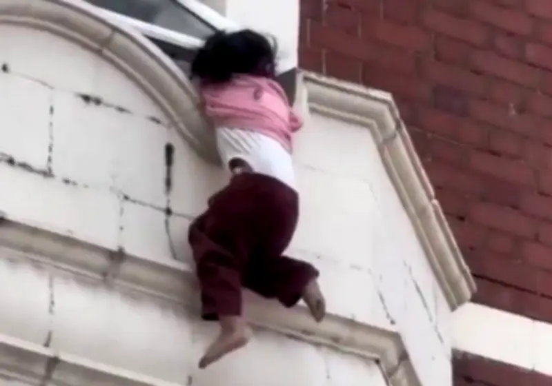 Three-Year-Old Girl Dangling from Window Ledge Rescued by Heroic Stranger and Police