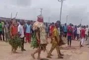 Masquerades lead protest against farmland acquisition for solar project in Niger